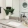 Large well lit bathroom with fullsize washer and dryer