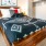 Spacious and well lit bedroom with plush carpet and large windows
