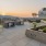 Large rooftop patio with BBQ area and a view overlooking Portland