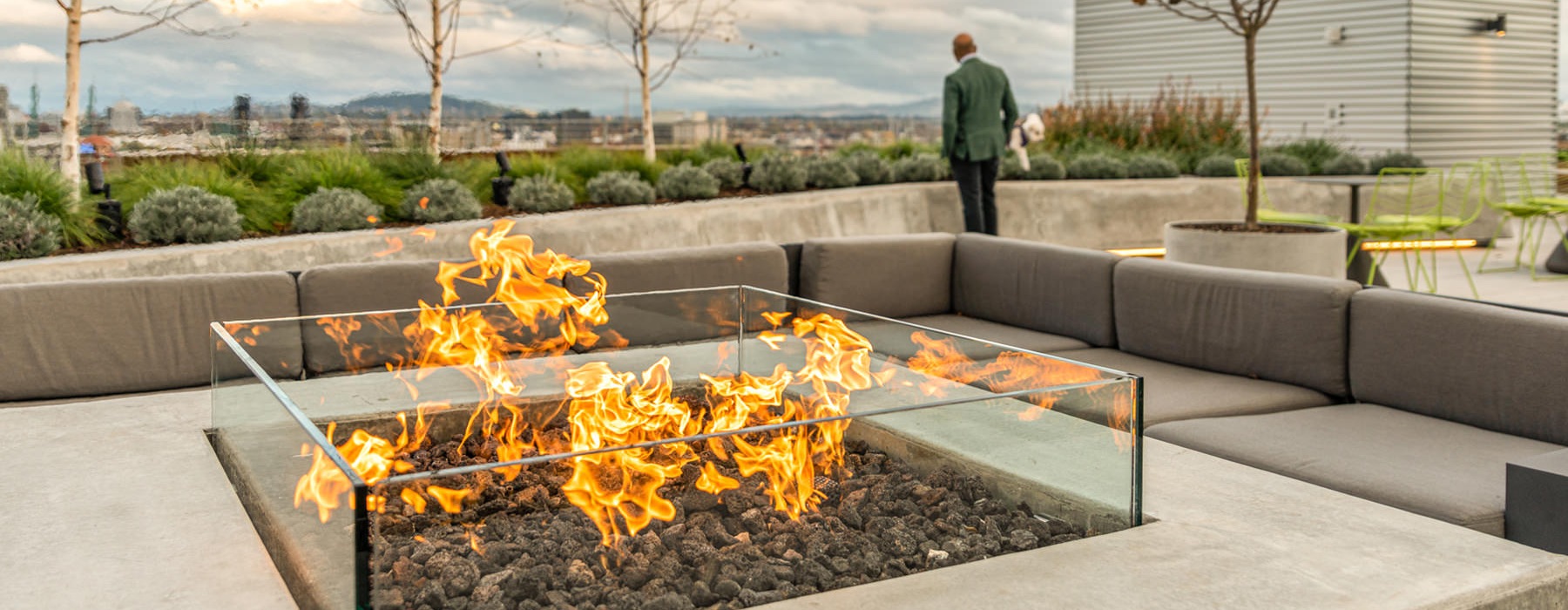 Large rooftop firepit with a view of the city
