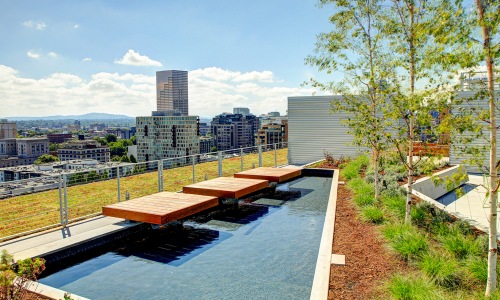 Large rooftop wading pool with a view of the city 