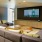 Large theatre room with ample seating and.a large TV screen 
