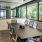 Large meeting room with a long table and large windows 