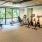 Large fitness center with cardio and weight lifting equipment.